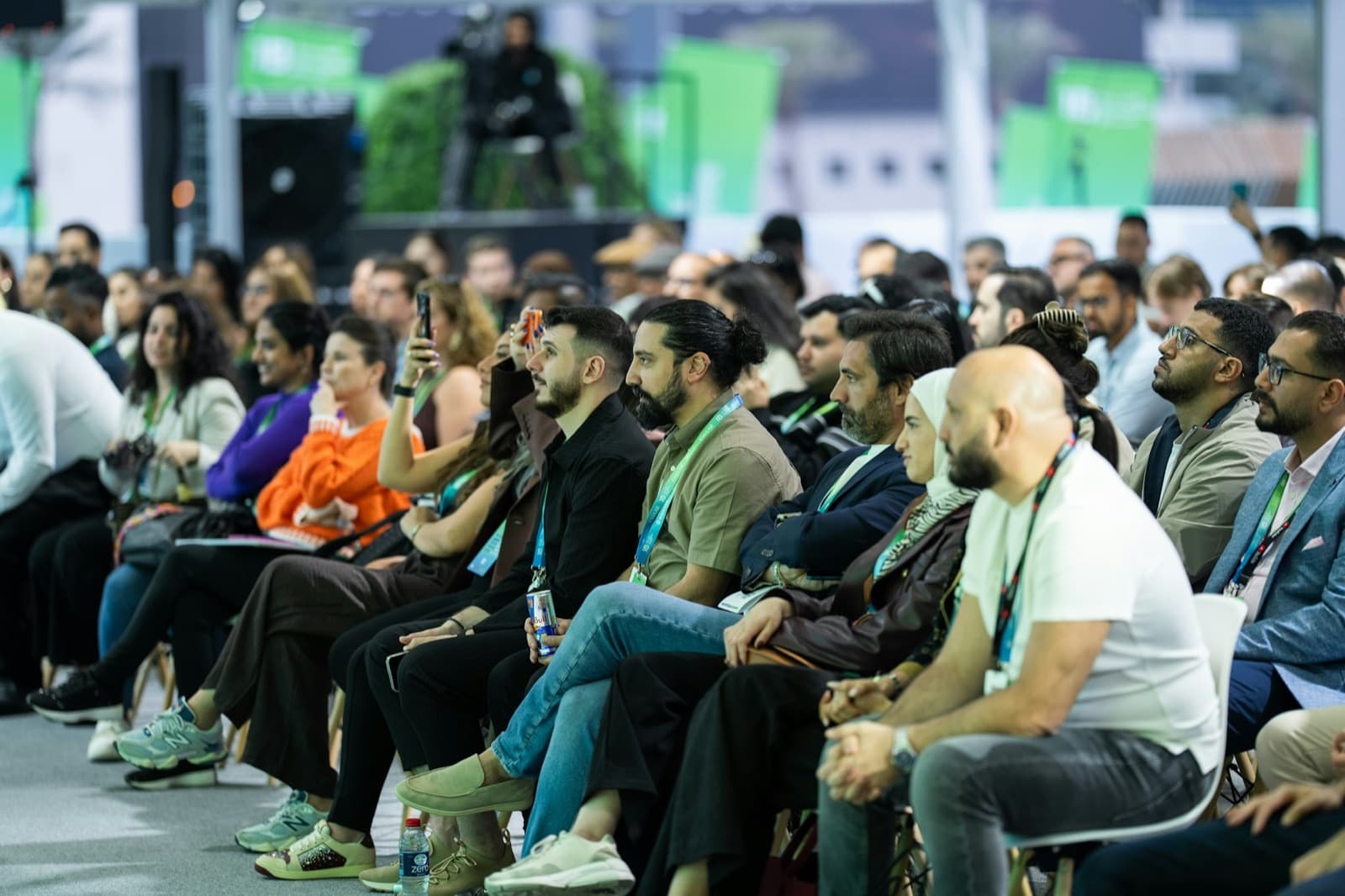 An international audience listening attentively at a conference